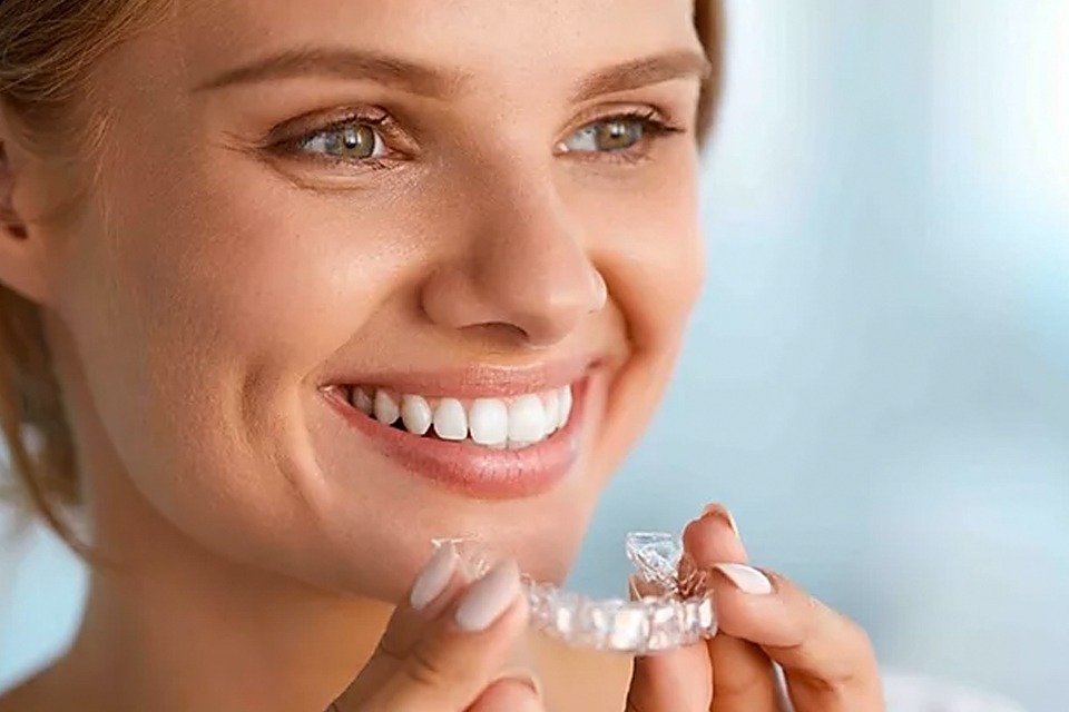 happy invisalign patient with perfect smile