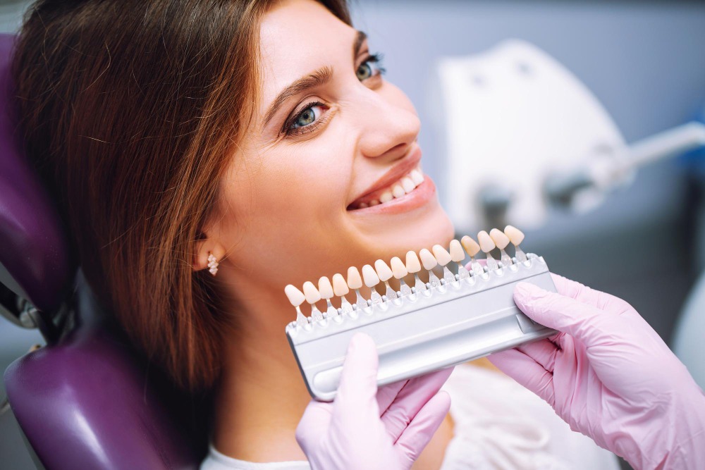 Teeth Whitening in Ilford, Essex 1 woman smiling in dental chair for professional teeth whitening treatment