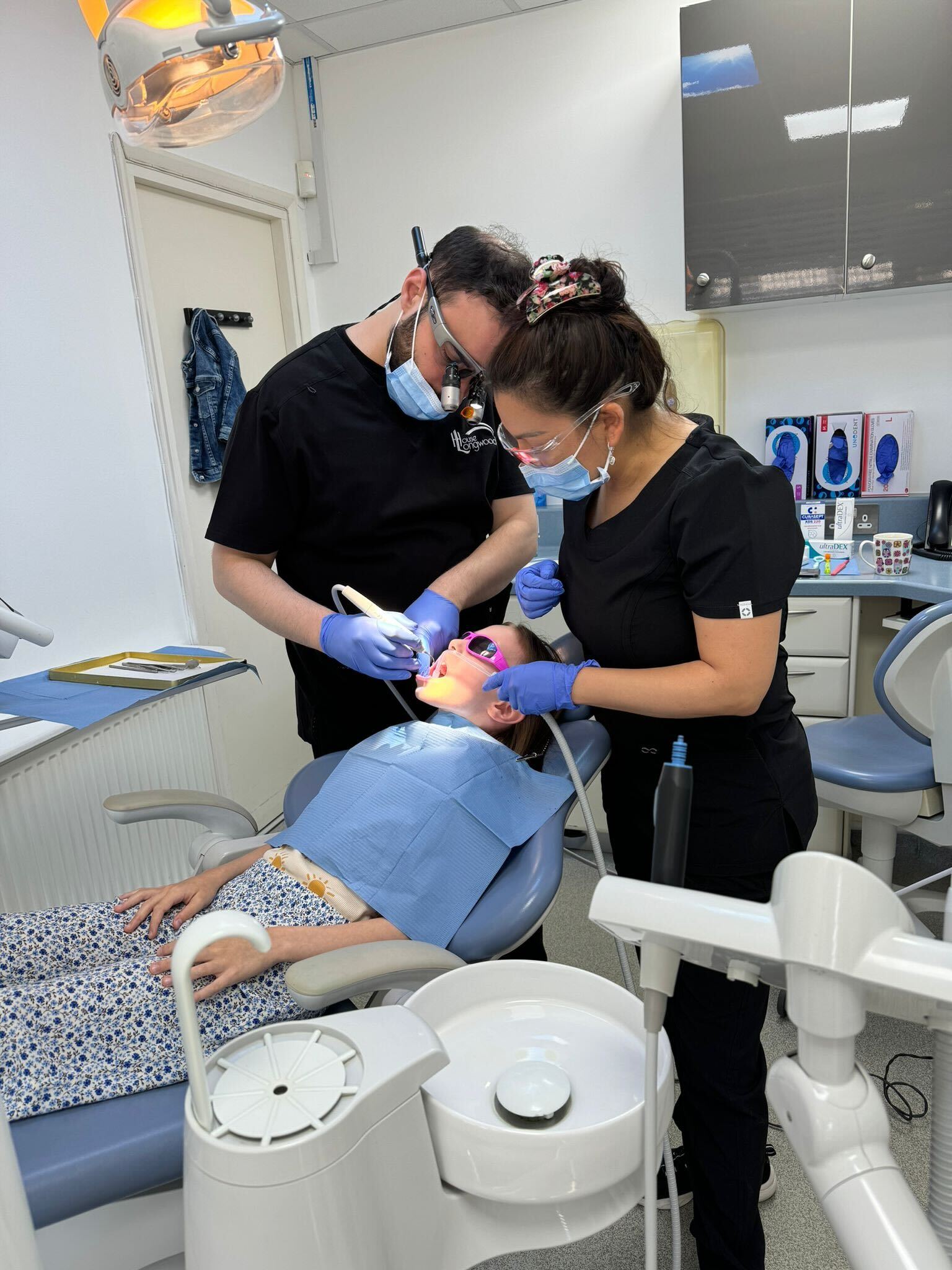 Amalgam Filling Removal in Ilford, Essex 1 dr george during dental hygiene treatment with kid